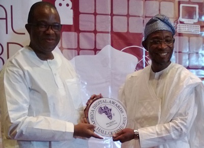 L-r:  Wale Ajisebutu, vice chairman, 21st Century being inducted into the ADA Hall fame by Governor Rauf Aregbesola of Osun State